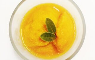 Pumpkin sorbet garnished with tiny sage leaves