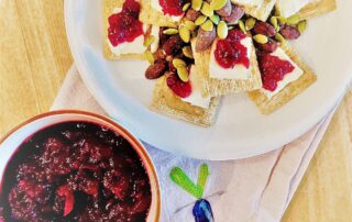 Cranberry sauce on cheese and crackers