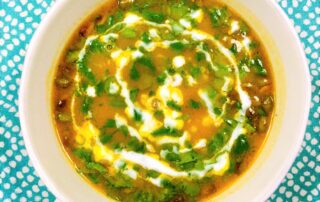 Pumpkin ginger soup with coconut cream and cilantro