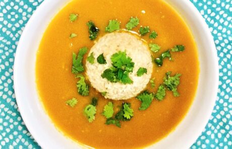 Pumpkin ginger soup with rice and cilantro