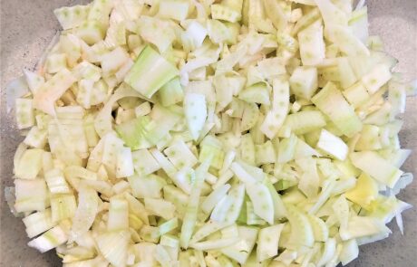 mixing chopped fennel with salt to macerate