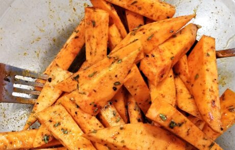 sweet potato fries tossed with oil and seasoning