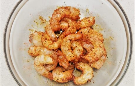 letting shrimp rest in cajun seasoning