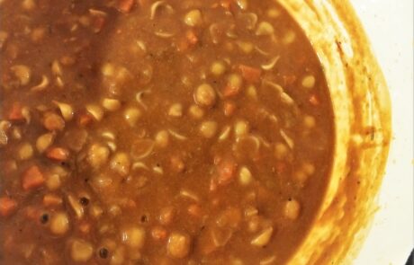 pasta cooking in the pot with blended ceci & veggies