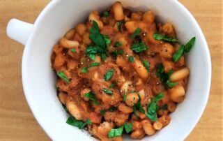 pumpkin pasta e ceci garnished with parsley