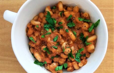 pumpkin based pasta e ceci topped with parsley